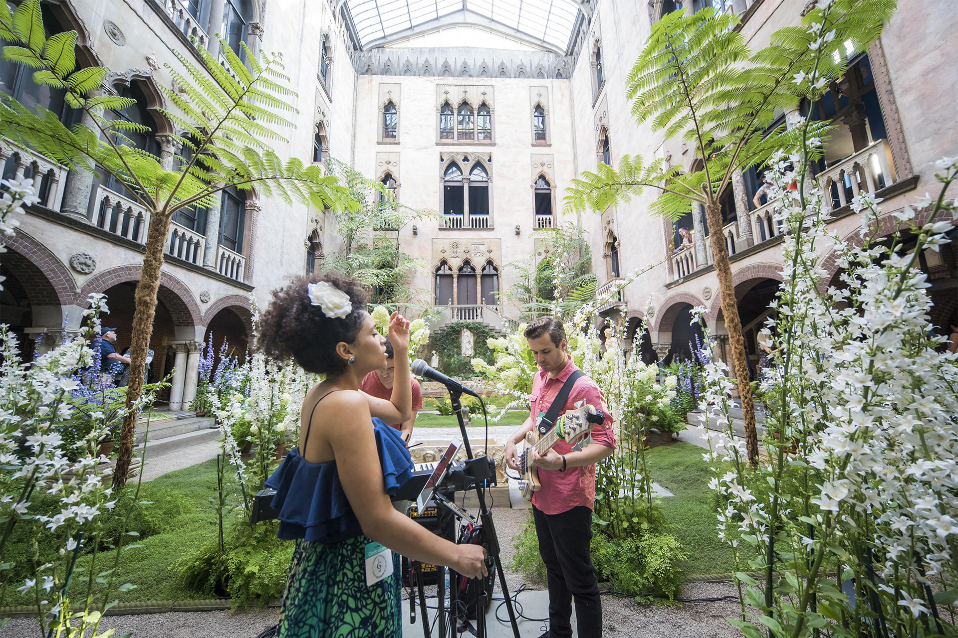 Performance by singer Alea in the Museum's courtyard during Neighborhood Nights event. Photo by Matt Teuten.